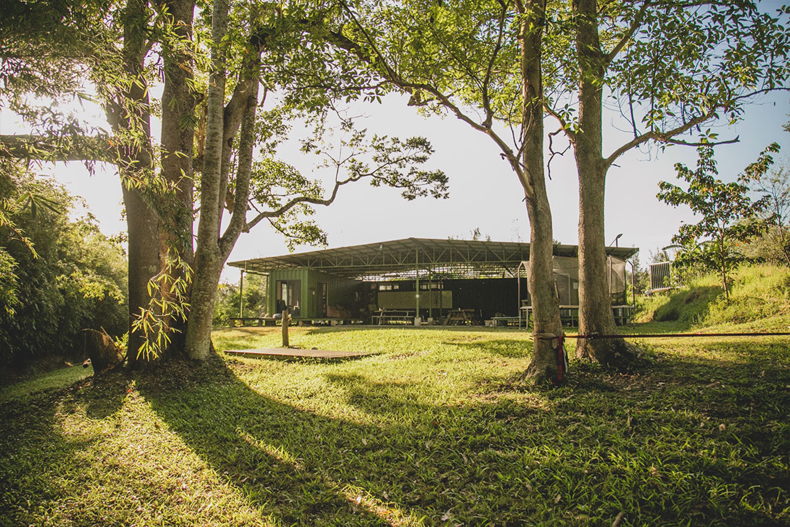 The open-sided learning pavilion at Zaytuna Farm among tall trees