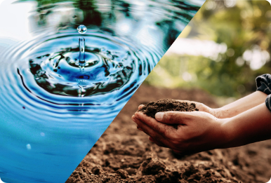 A water droplet beside hands holding soil